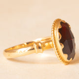 Solitario vintage in oro giallo 18K con granato, anni ‘40/‘50