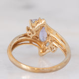 Anello bypass in oro giallo 9K con tanzaniti (0.91ctw ca.) e zaffiri bianchi