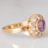 Anello a margherita vintage in oro giallo 18K con zaffiro rosa (1.70ct ca.) e diamanti di taglio brillante (1ctw ca.), anni ‘60/‘70