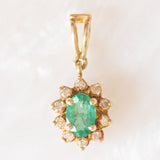 Ciondolo a margherita vintage in oro giallo 14K con smeraldo (0.40ct ca.) e diamanti di taglio brillante (0.15ctw ca.), anni ‘70/‘80