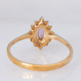 Anello a margherita in oro giallo 9K con zaffiro viola sintetico (0.25ct) e zirconi bianchi