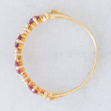 Mezzo eternity vintage in oro giallo 18K con rubini (0.40ctw ca.) e diamanti di taglio brillante (0.50ctw ca.), anni ‘80