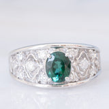 Anello a fascia in platino con tormalina verde (1.13ct) e diamanti (0.38ctw) e con lavorazioni a traforo, anni '90/anni '2000