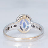 Anello a margherita vintage in oro bianco 18K con tanzanite (2.30ct ca.) e diamanti di taglio brillante (0.20ctw ca.), anno ‘70/‘80