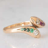 Anello contrarier antico a doppio serpente in oro giallo 14K con smeraldi, rubini e diamanti di taglio vecchio (0.16ctw ca.), anni ‘20
