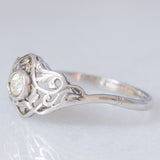 Anello Art Nouveau in oro bianco 18K con diamante di taglio vecchia miniera (0.10ct ca.), anni ‘20/‘30