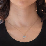 Ciondolo vintage in oro giallo e bianco 14K con topazio azzurro (2ct ca.) e diamanti (0.03ctw ca.), anni ‘70