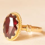 Solitario vintage in oro giallo 18K con granato, anni ‘40/‘50