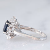 Anello a margherita vintage in platino con zaffiro (1.27ct) e diamanti (0.43ctw), anni ‘80