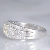 Anello a fascia vintage in platino con diamanti per un totale di 1.25ct (centrale di taglio princess 0.78ct), anni ‘80