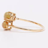 Anello vintage "bypass" in oro 9k e opali, 1989
