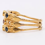 Anello harem vintage in oro giallo 18k con diamanti, rubini e zaffiri. Anni '70