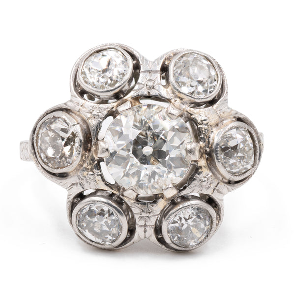 Anello antico a fiore in platino con diamante centrale (1ct) e contorno di diamanti (1,20ct), anni '30