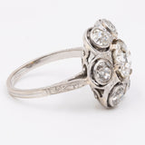 Anello antico a fiore in platino con diamante centrale (1ct) e contorno di diamanti (1,20ct), anni '30