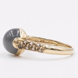 Anello in oro giallo 9k con calcedonio e quarzi fumé