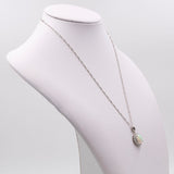 Collana vintage in platino con ciondolo il platino con opale (1,78ct) e diamanti (0,56ctw)