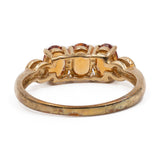 Anello trilogy in oro giallo 9k con granati arancioni (1,12ctw) e diamanti