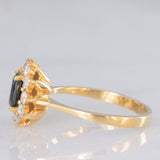 Anello a margherita vintage in oro giallo 18K con zaffiro (0.70ct ca.) e diamanti di taglio brillante (0.40ctw ca.), anni ‘80/‘90