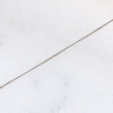 Collier vintage in platino con ciondolo a margherita con smeraldo (0.35ct) e diamanti (0.23ctw)