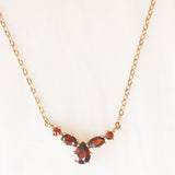 Collier vintage in oro giallo 8K con granati (1ctw ca.), anni ‘60/‘70