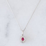 Collana vintage in platino con ciondolo con rubino (0.26ct) e diamanti di taglio brillante (0.13ctw)