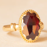 Solitario vintage in oro giallo 18K con granato, anni ‘40/‘50