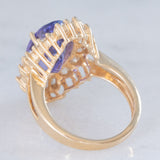 Anello ballerina vintage in oro giallo 14K con tanzanite (5.60ct ca.) e diamanti di taglio brillante e tapered (1.30ctw ca.), anni ‘80