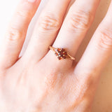 Anello a margherita vintage in oro giallo 9K con granati, anno 1979