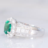 Anello a fiore vintage in platino con smeraldo (0.81ct) e diamanti (0.93ctw), anni ‘80
