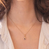 Ciondolo vintage in oro giallo 9K con rubino e diamanti di taglio brillante (0.14ctw ca.), anni ‘70/‘80