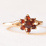 Anello a margherita vintage in oro giallo 9K con granati, anno 1979