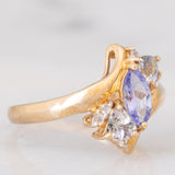 Anello bypass in oro giallo 9K con tanzaniti (0.91ctw ca.) e zaffiri bianchi