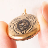 Ciondolo portafoto antico in oro giallo 18K con smalti neri e perlina bianca, primi del ‘900