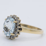 Anello a margherita vintage in oro giallo 9K con acquamarina (2ct ca.) e diamanti (0.18ctw ca.), anni 2000