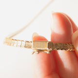 Collana vintage in oro giallo 8K con maglia omega