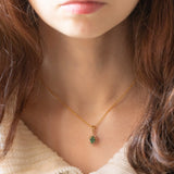 Ciondolo a margherita vintage in oro giallo 14K con smeraldo (0.40ct ca.) e diamanti di taglio brillante (0.15ctw ca.), anni ‘70/‘80