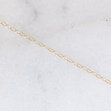 Collana vintage con catenina in oro giallo 9K e con ciondolo a margherita in oro giallo e bianco 9K con rubino (0.40ct ca.) e diamanti