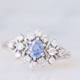 Anello a margherita vintage in platino con zaffiro (0.60ct) e diamanti (0.41ctw), anni ‘90