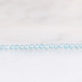 Collana moderna con acquamarine, perla bianca e oro giallo 14K