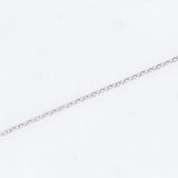 Collana vintage con ciondolo a margherita in oro bianco 14K con rubino di taglio a goccia (0.65ct ca.) e diamanti di taglio brillante (0.35ctw ca.), anni ‘80