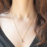 Collana vintage con catenina in oro giallo 9K e con ciondolo a margherita in oro giallo 9K con acquamarina (0.30ct ca.) e diamanti (0.06ctw ca.)