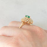 Anello ballerina vintage in oro giallo 14K con smeraldo (0.50ct ca.) e diamanti di taglio brillante e tapered (0.96ctw ca.), anni ‘80