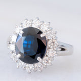 Anello a margherita vintage in platino con zaffiro (4.30ct) e diamanti (1.05ctw), anni ‘80