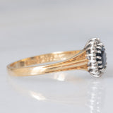 Anello a margherita vintage in oro giallo 9K con zaffiro (0.70ct ca.) e diamanti (0.08ctw ca.), anno 1991