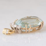 Ciondolo vintage in oro giallo e bianco 14K con acquamarina (10ct ca.) e diamanti di taglio brillante (0.25ctw ca.), anni ‘70