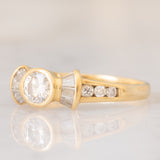 *RISERVATO* Anello “ballerina” in oro giallo 18K con diamanti di taglio brillante e di taglio tapered (0.71ctw ca.), anni ‘80