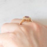 Anello a margherita vintage in oro giallo 14K con rubino (1.50ct ca.) e diamanti (0.16ctw ca.), anni ‘70/‘80