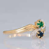 Toi et Moi vintage in oro giallo 18K con zaffiro (0.09ct ca.), smeraldo (0.06ct ca.) e diamanti, anni ‘70/‘80