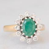Anello a margherita vintage in oro giallo e bianco 14K con smeraldo (1.75ct ca.) e diamanti di taglio brillante (0.72ctw ca.), anni ‘70