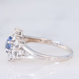 Anello a margherita vintage in platino con zaffiro (0.60ct) e diamanti (0.41ctw), anni ‘90
